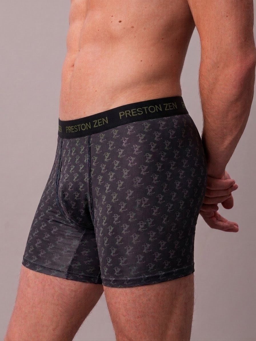 The Preston Zen boxer brief worn, side view, showing the repeated monogram print and the branded elastic waistband.
